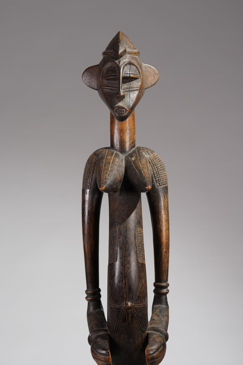 An outstanding female Senufo Déblé or guardian sculpture