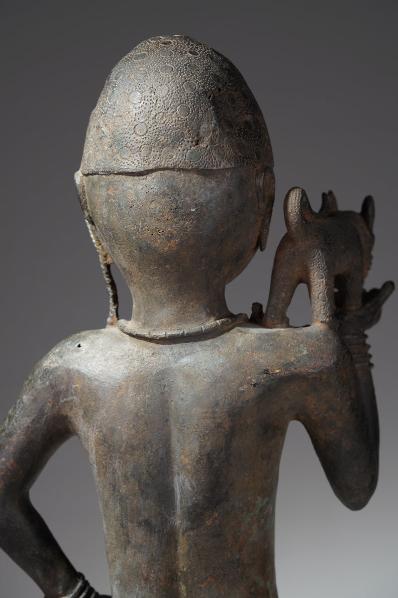 A bronze sculpture of a servant in the style of Benin