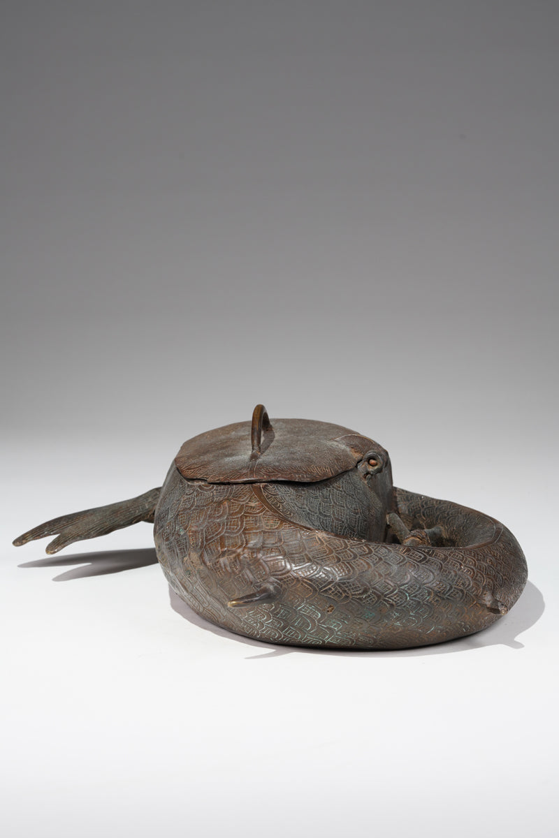 A Kola nut container in the style of Benin