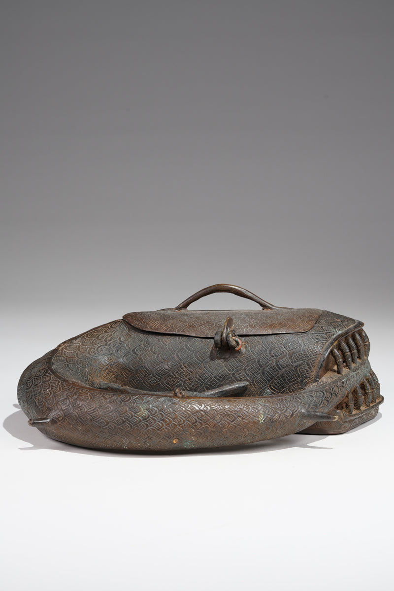 A Kola nut container in the style of Benin