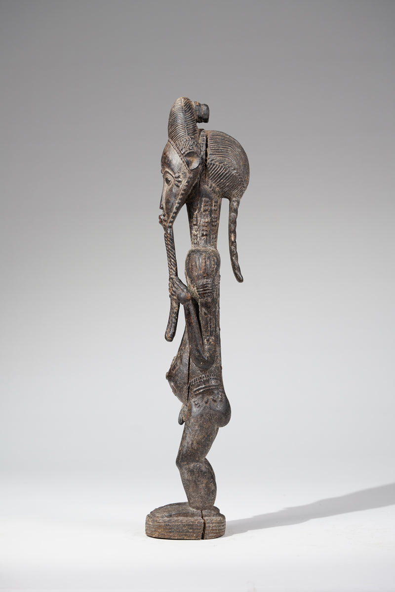 A male Baule sculpture of wiseness