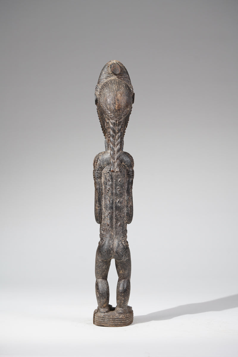 A male Baule sculpture of wiseness