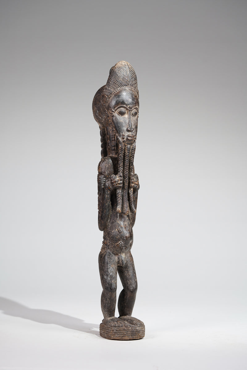 A male Baule sculpture of wiseness