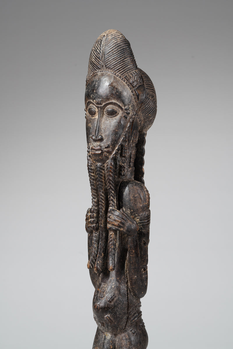 A male Baule sculpture of wiseness