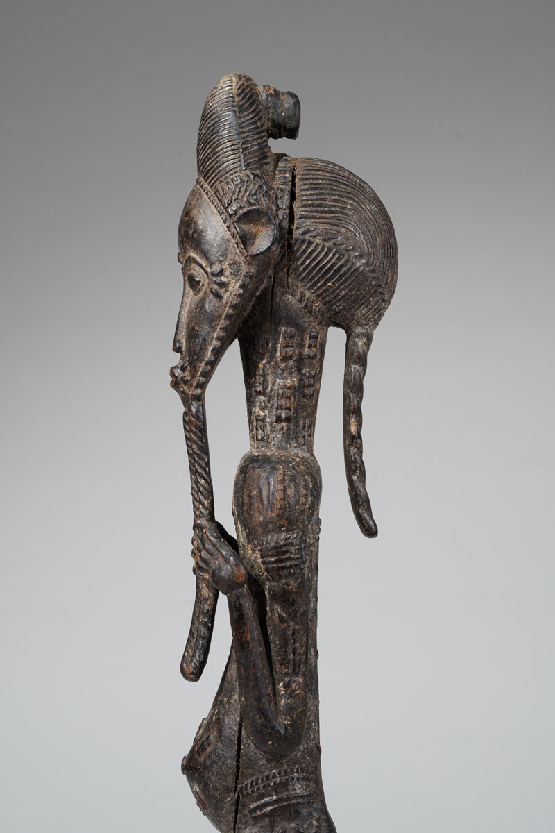 A male Baule sculpture of wiseness