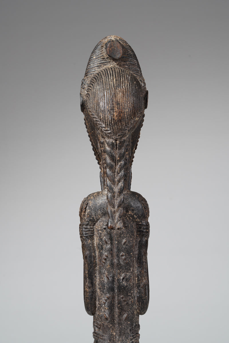 A male Baule sculpture of wiseness