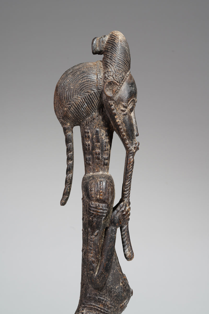 A male Baule sculpture of wiseness