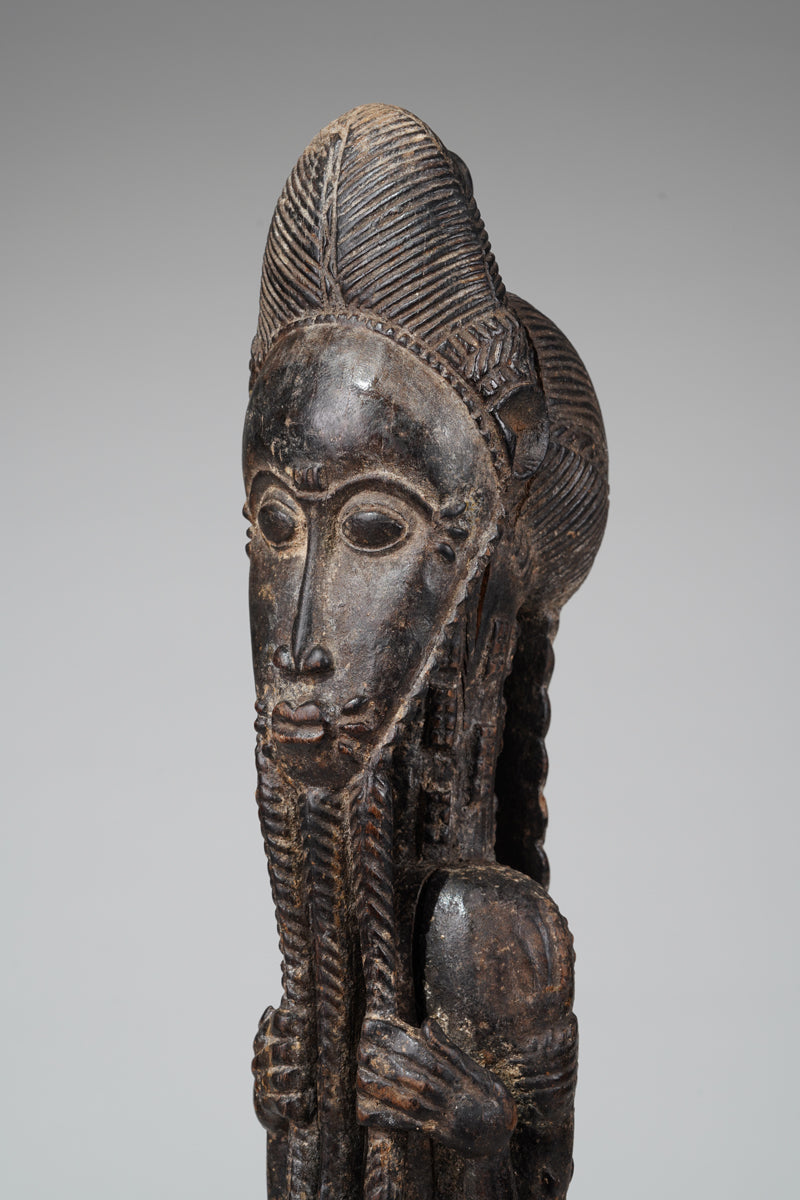 A male Baule sculpture of wiseness
