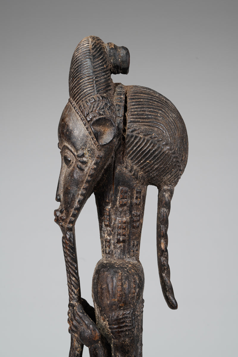 A male Baule sculpture of wiseness