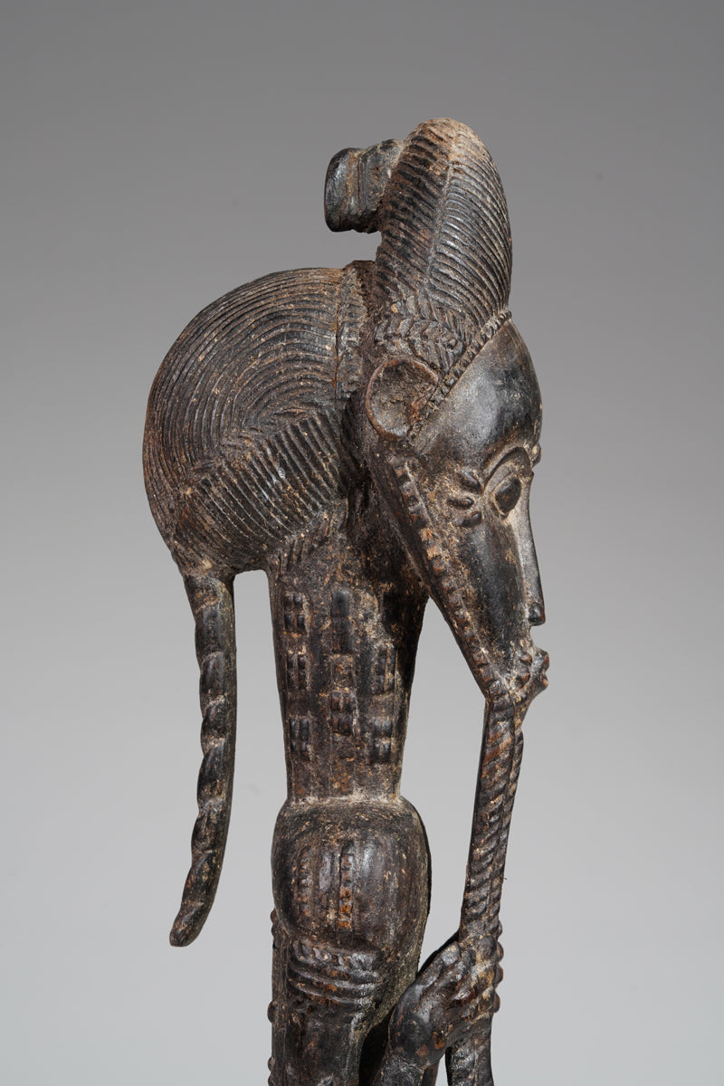 A male Baule sculpture of wiseness