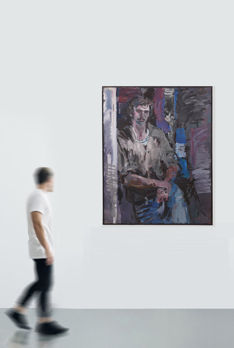 A middle-aged man in a casual and relaxed pose