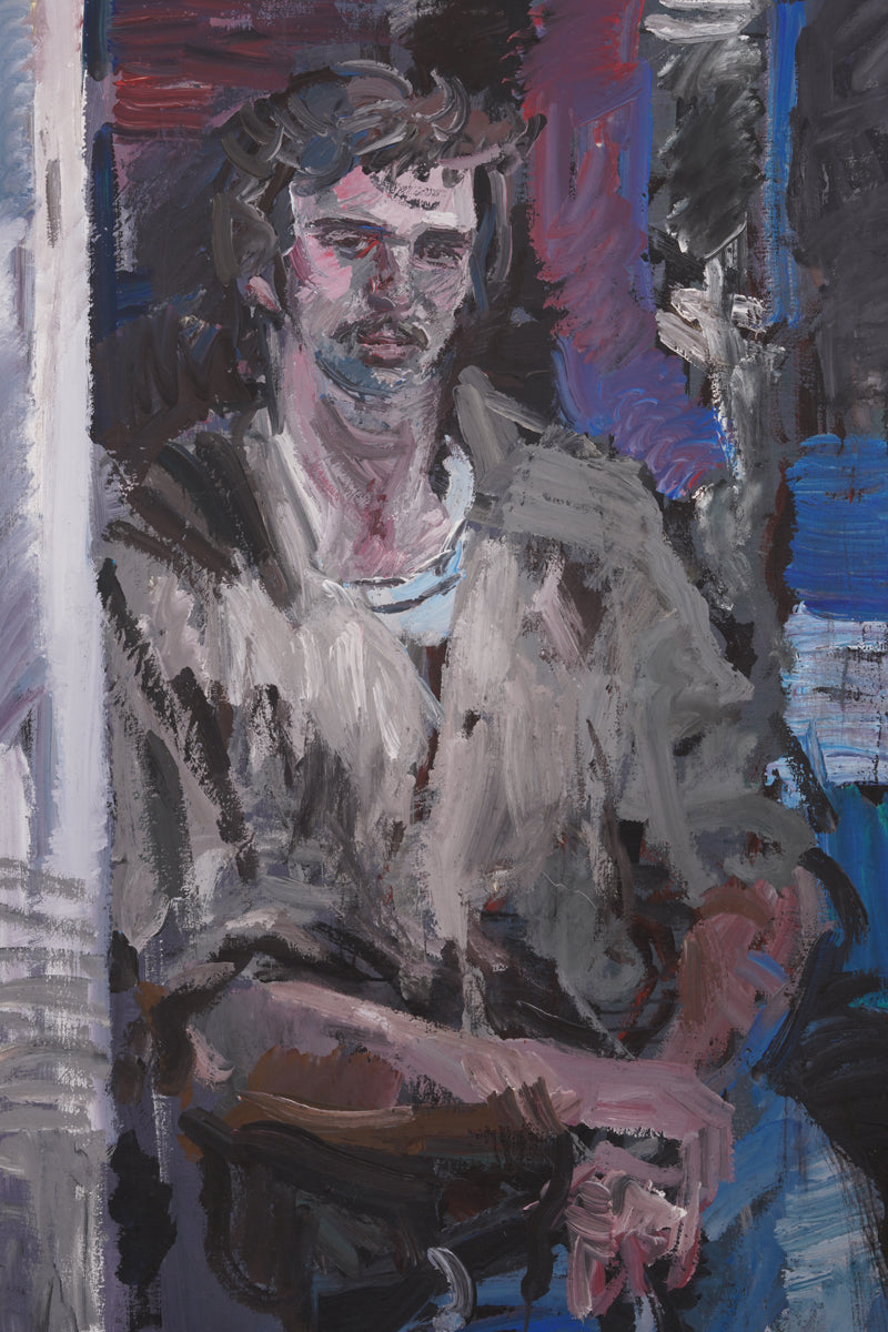 A middle-aged man in a casual and relaxed pose