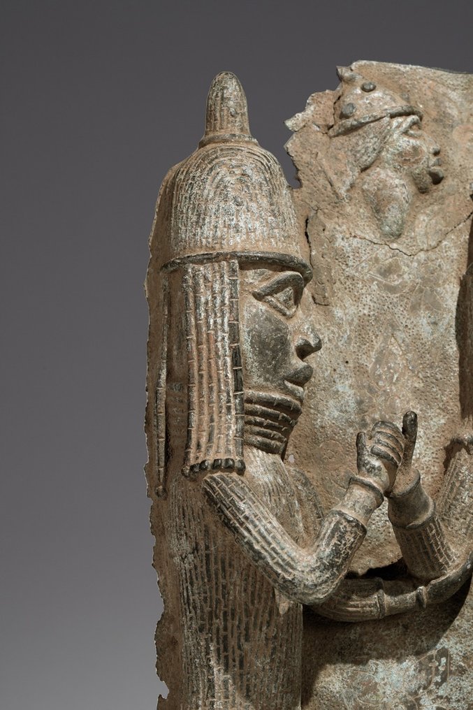 A fragmentary brass plate in the style of Benin