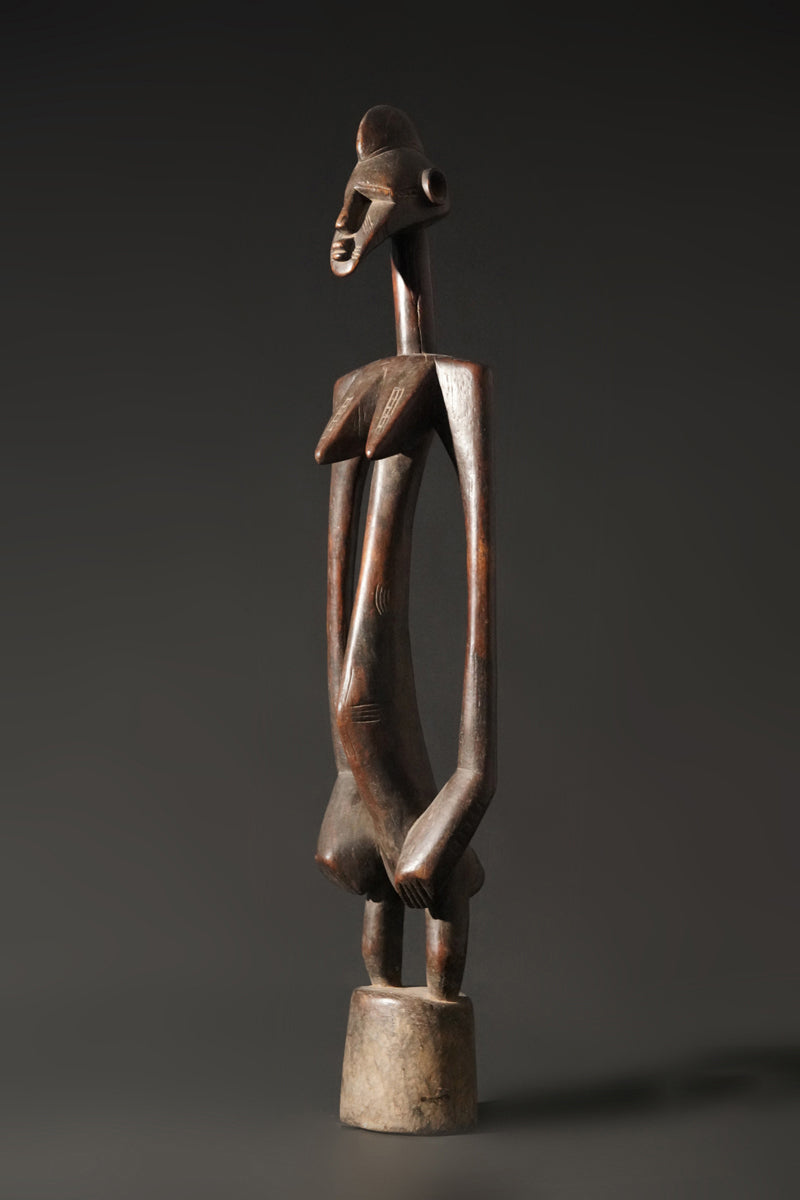 A high aged female Senufo Rhythm Pounder, called "Deblé