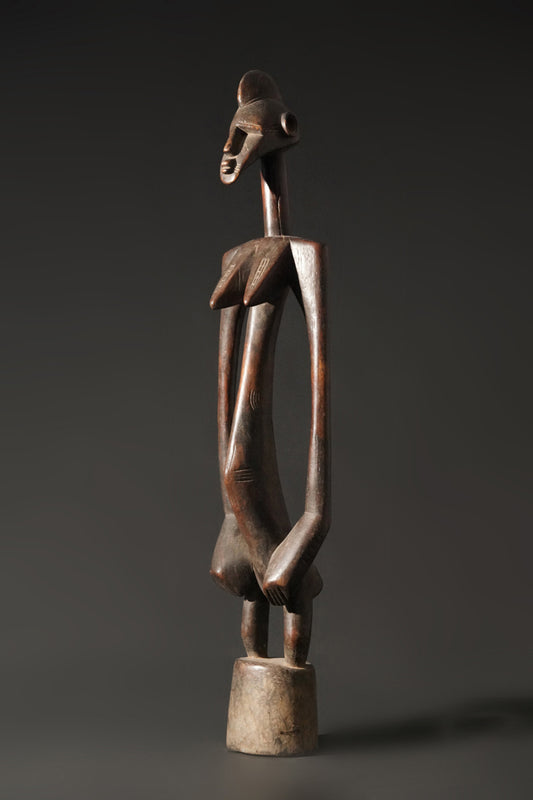 A high aged female Senufo Rhythm Pounder, called "Deblé