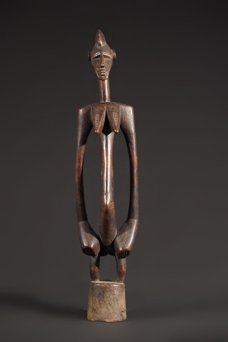 A high aged female Senufo Rhythm Pounder, called "Deblé