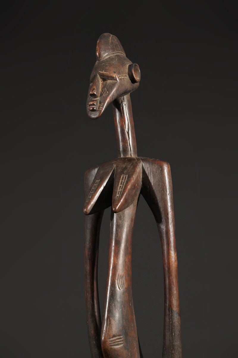 A high aged female Senufo Rhythm Pounder, called "Deblé