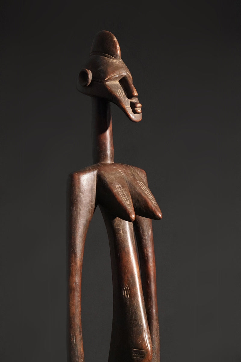 A high aged female Senufo Rhythm Pounder, called "Deblé