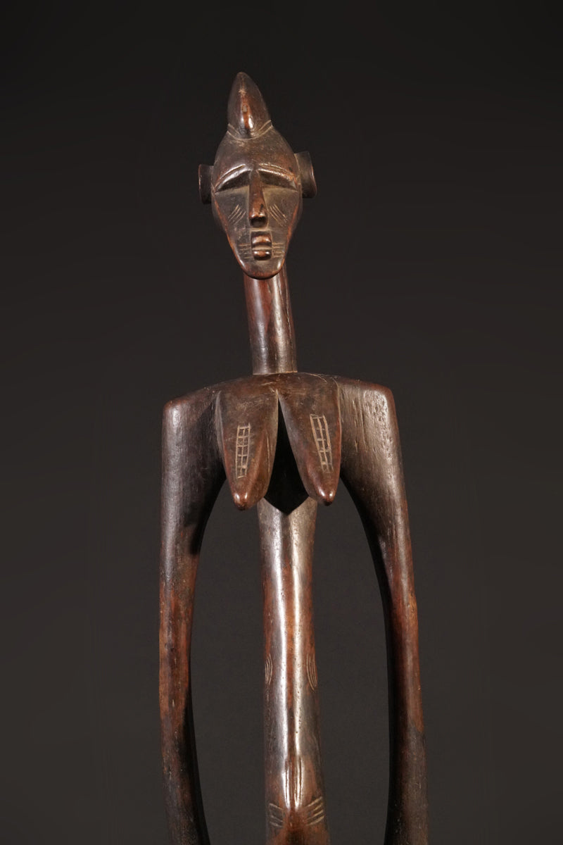 A high aged female Senufo Rhythm Pounder, called "Deblé