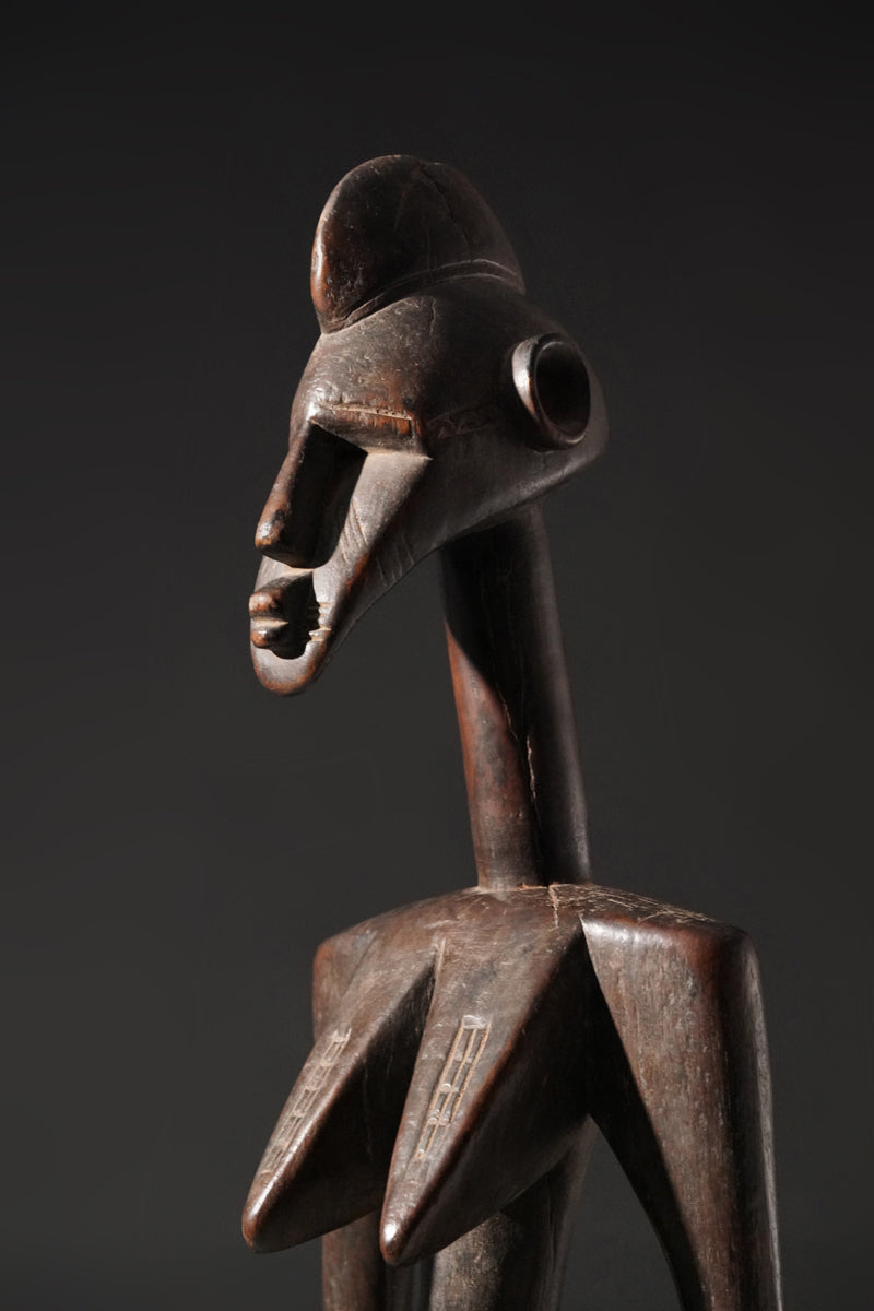 A high aged female Senufo Rhythm Pounder, called "Deblé
