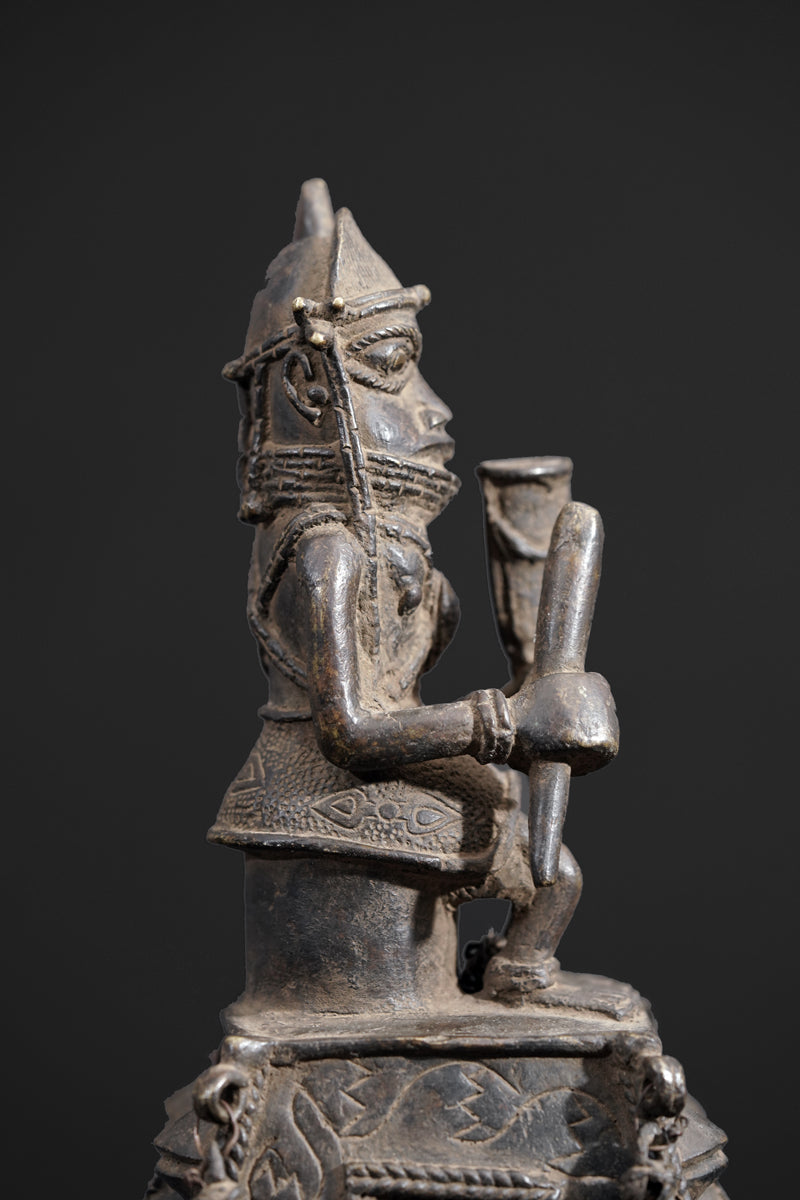 A bronze bell in the style of Benin