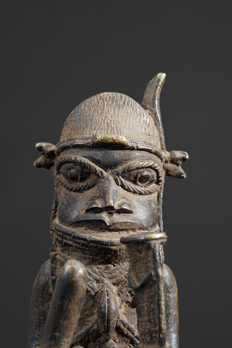 A bronze bell in the style of Benin