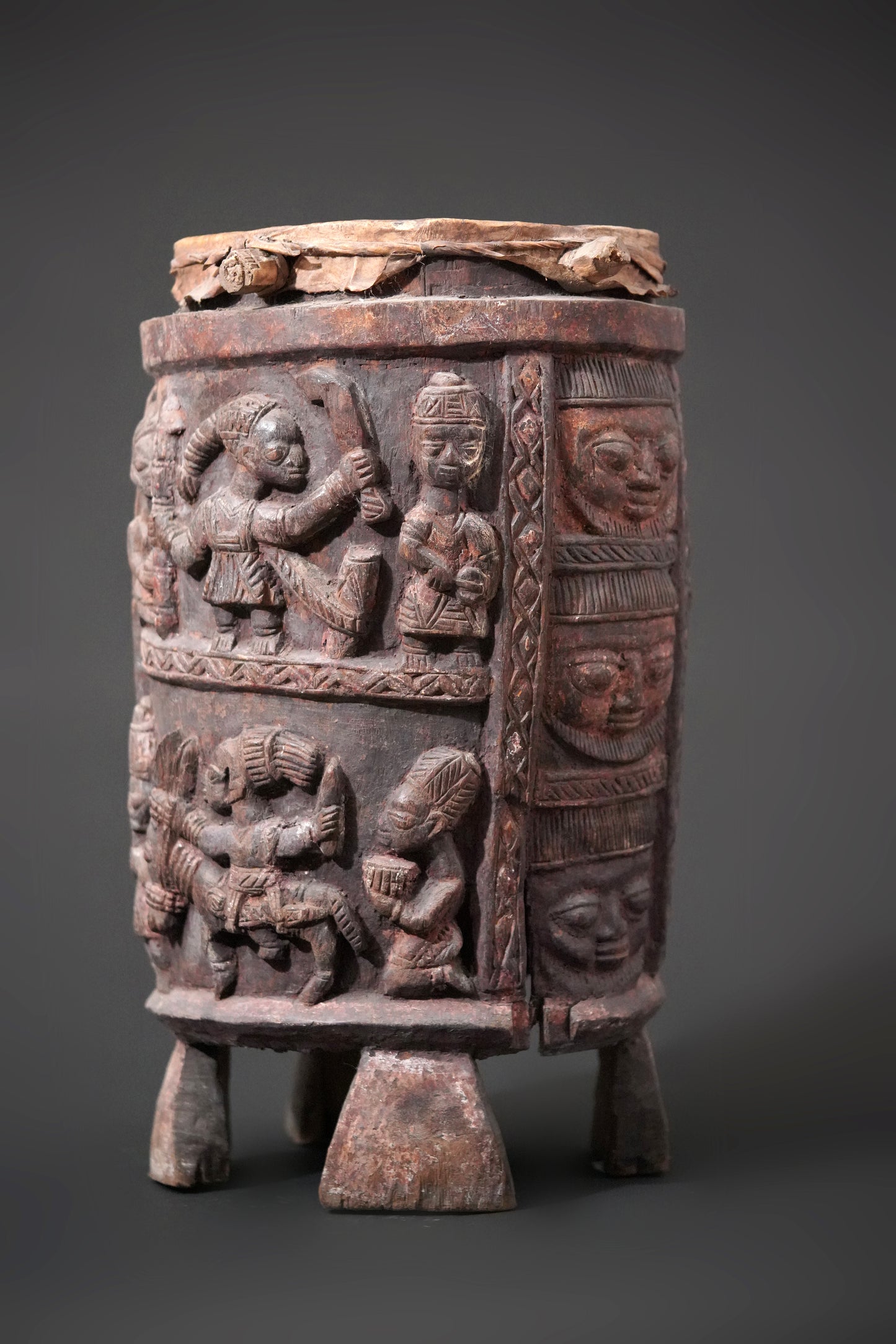 A round, one-piece standing drum on four legs