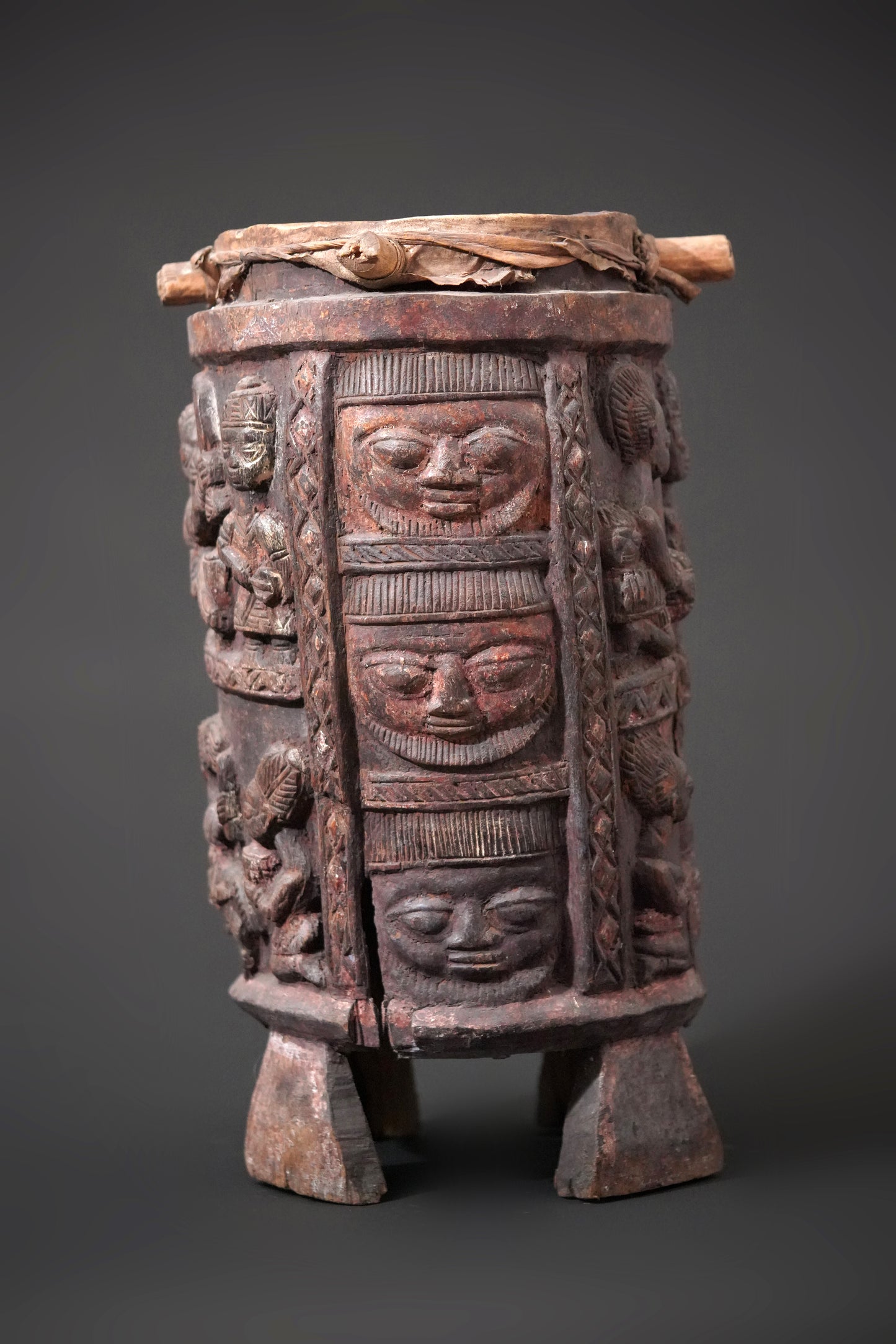 A round, one-piece standing drum on four legs