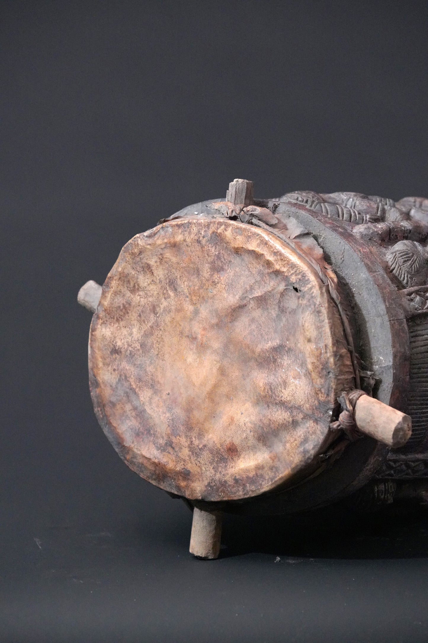 A round, one-piece standing drum on four legs