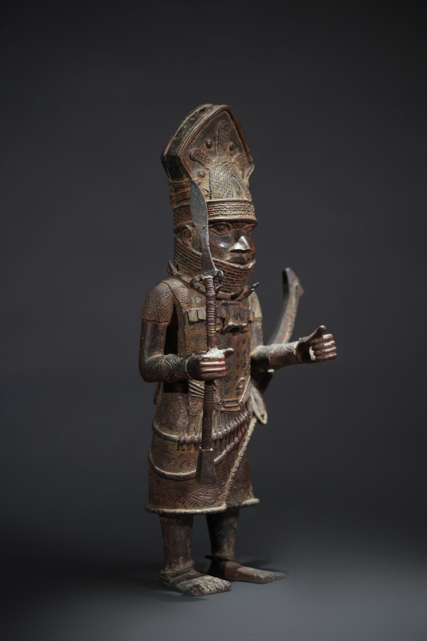 A Dignitary, brass, lost mould casting, Benin