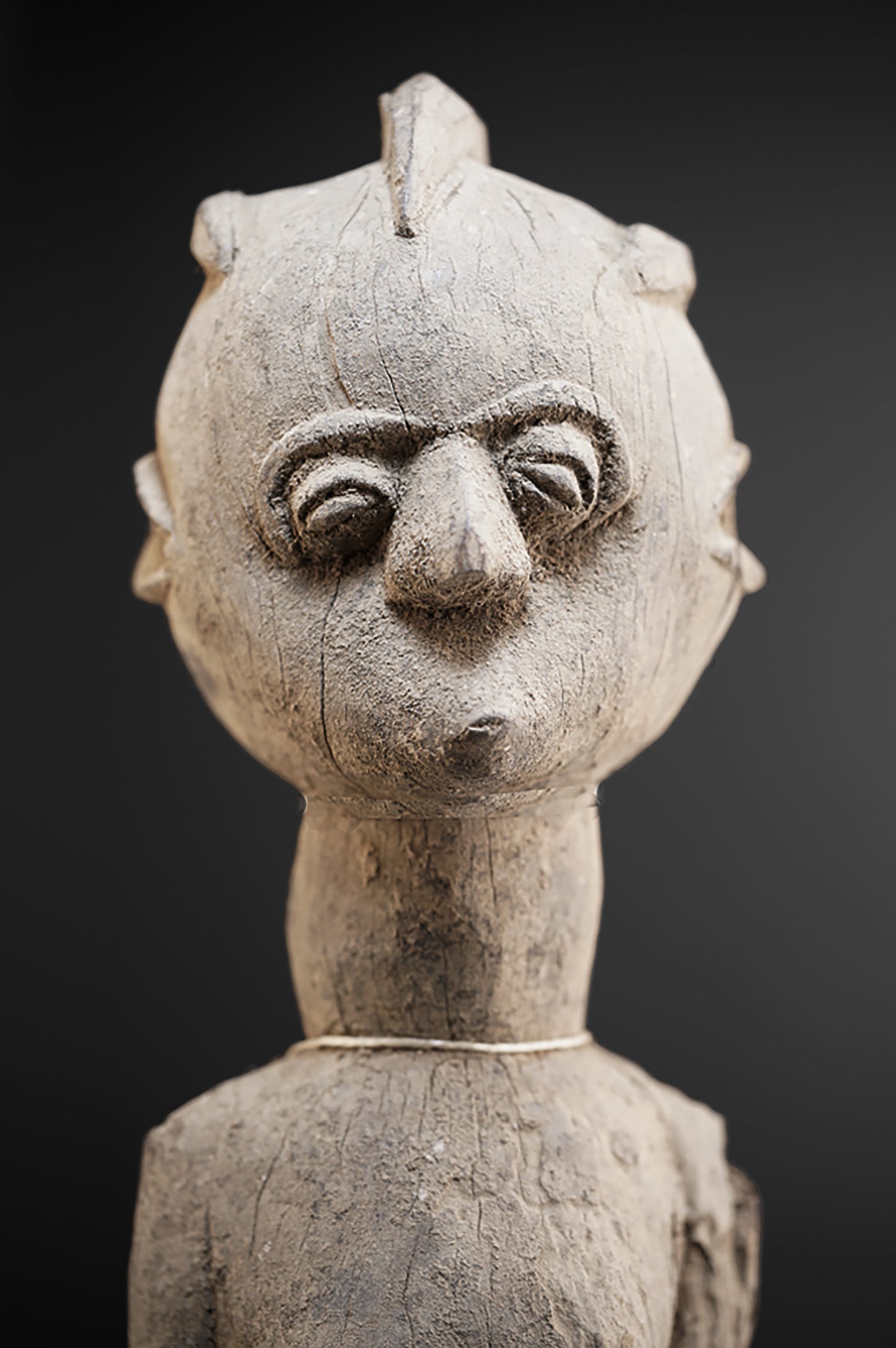 A fragmentary female Lobi sculpture