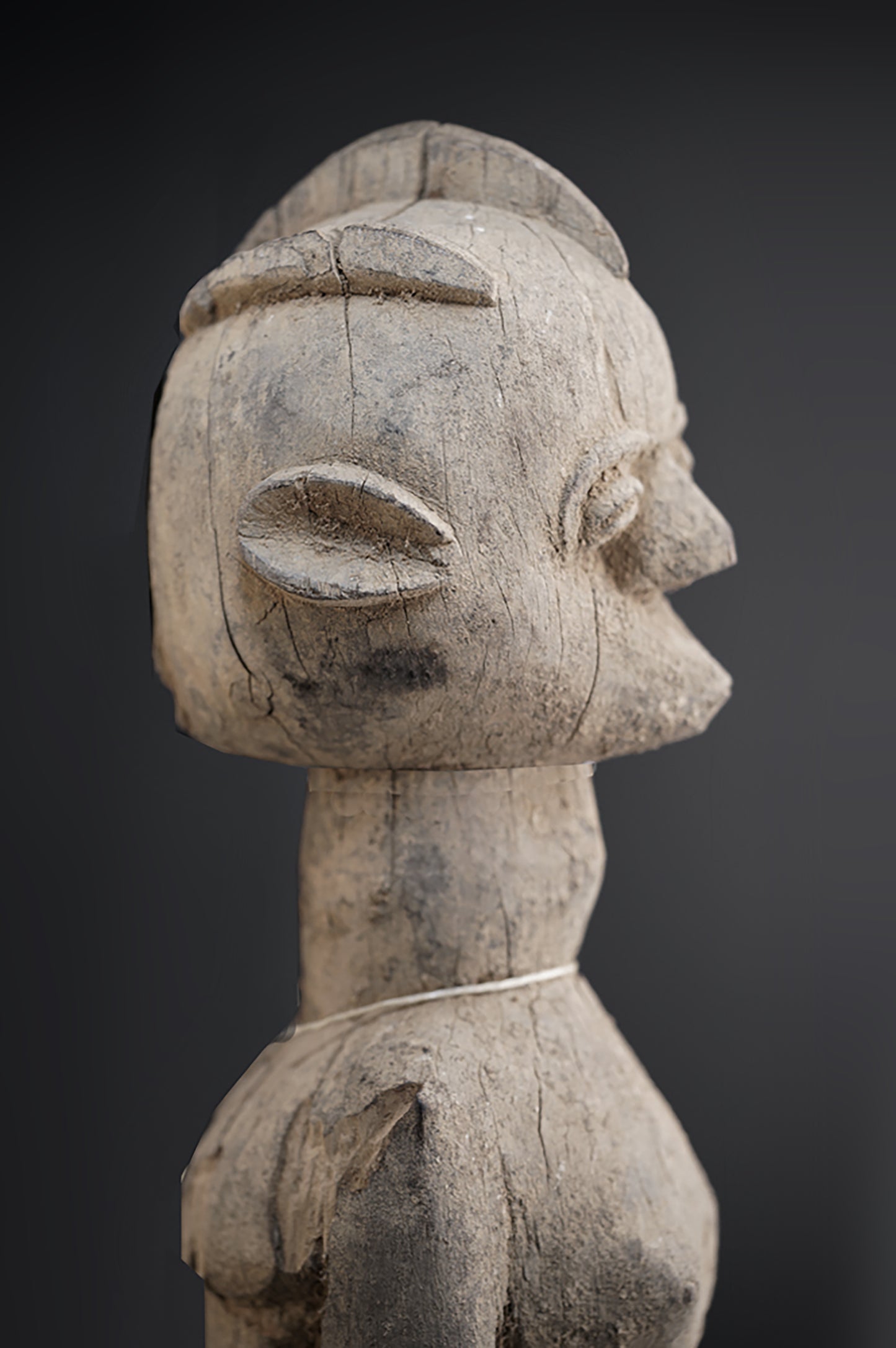 A fragmentary female Lobi sculpture