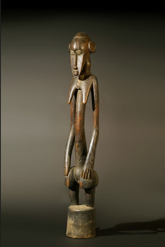 A high aged female Senufo Rhythm Pounder, called "Deblé