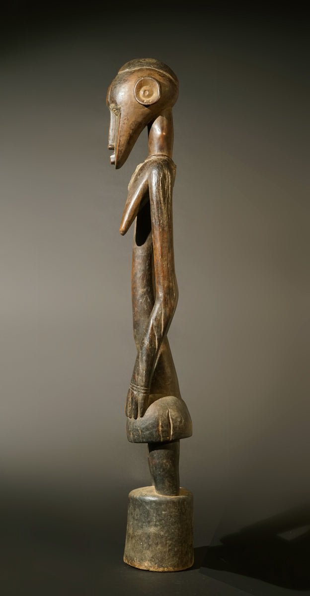 A high aged female Senufo Rhythm Pounder, called "Deblé