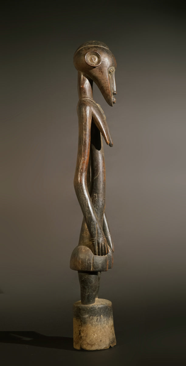 A high aged female Senufo Rhythm Pounder, called "Deblé