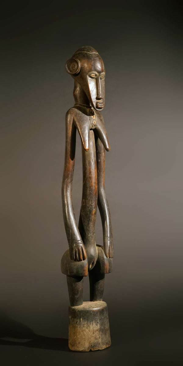 A high aged female Senufo Rhythm Pounder, called "Deblé