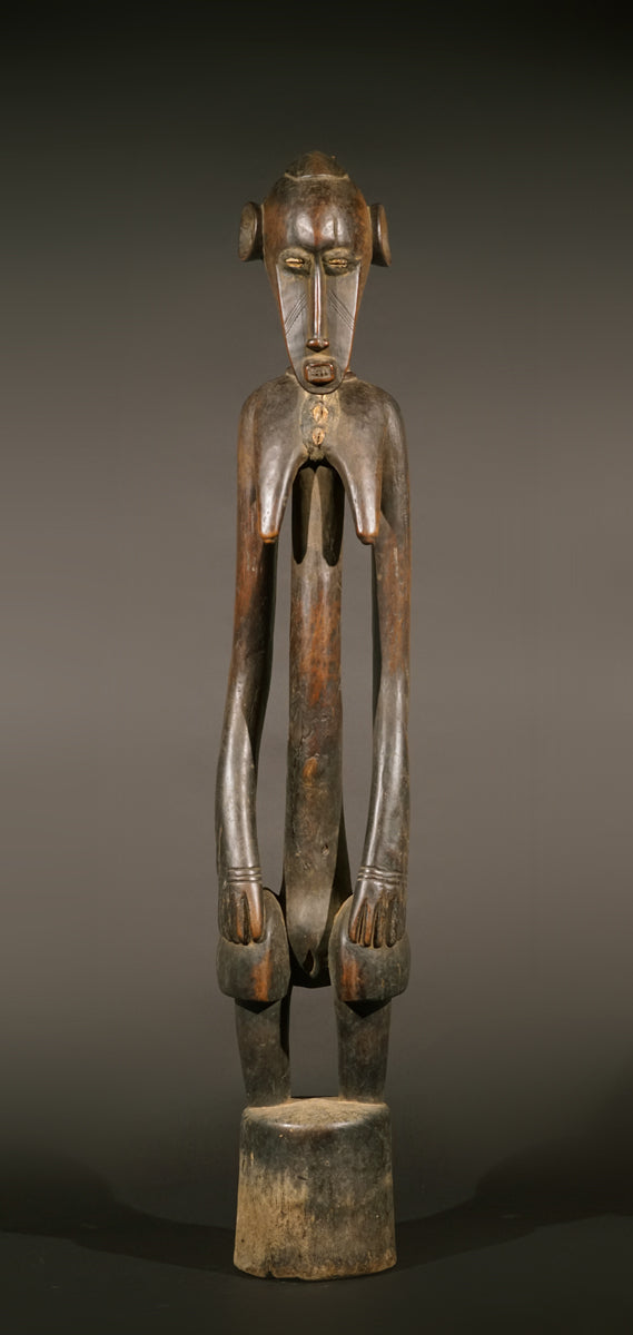 A high aged female Senufo Rhythm Pounder, called "Deblé
