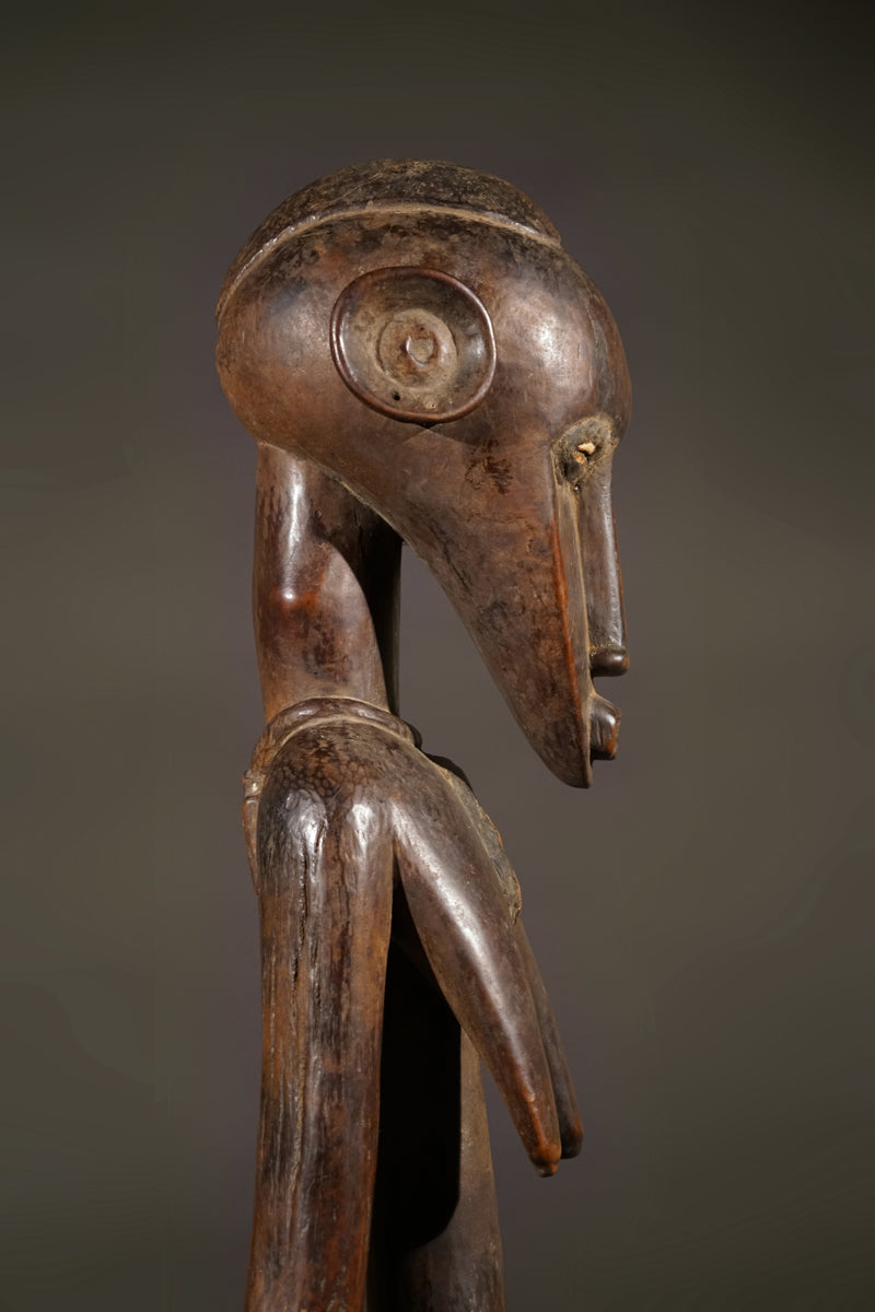 A high aged female Senufo Rhythm Pounder, called "Deblé