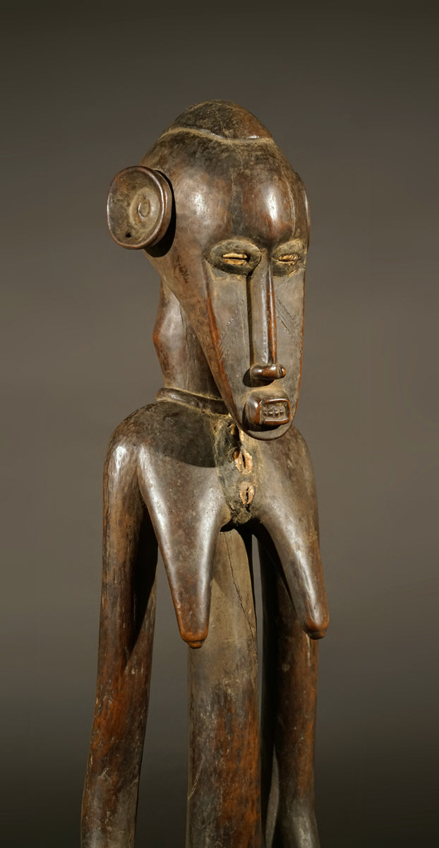A high aged female Senufo Rhythm Pounder, called "Deblé