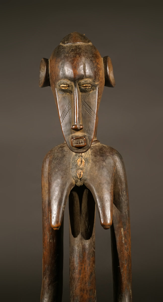 A high aged female Senufo Rhythm Pounder, called "Deblé