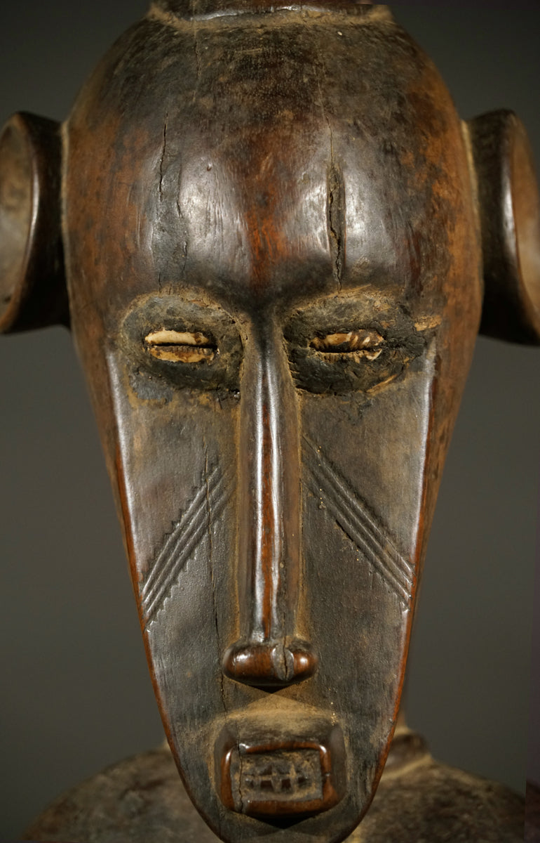 A high aged female Senufo Rhythm Pounder, called "Deblé