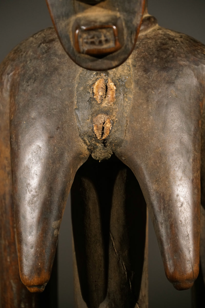 A high aged female Senufo Rhythm Pounder, called "Deblé