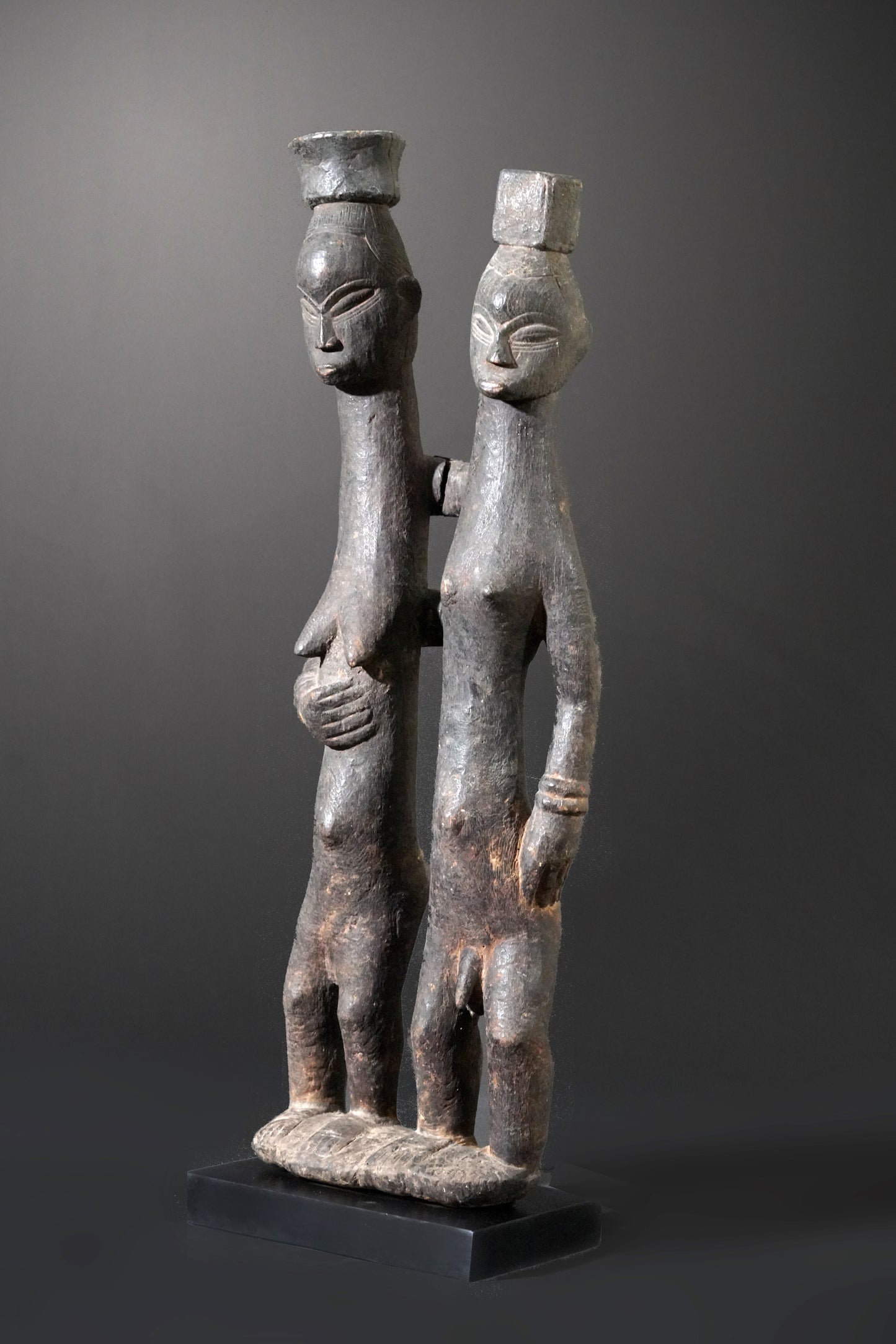 A Guro couple standing on one base