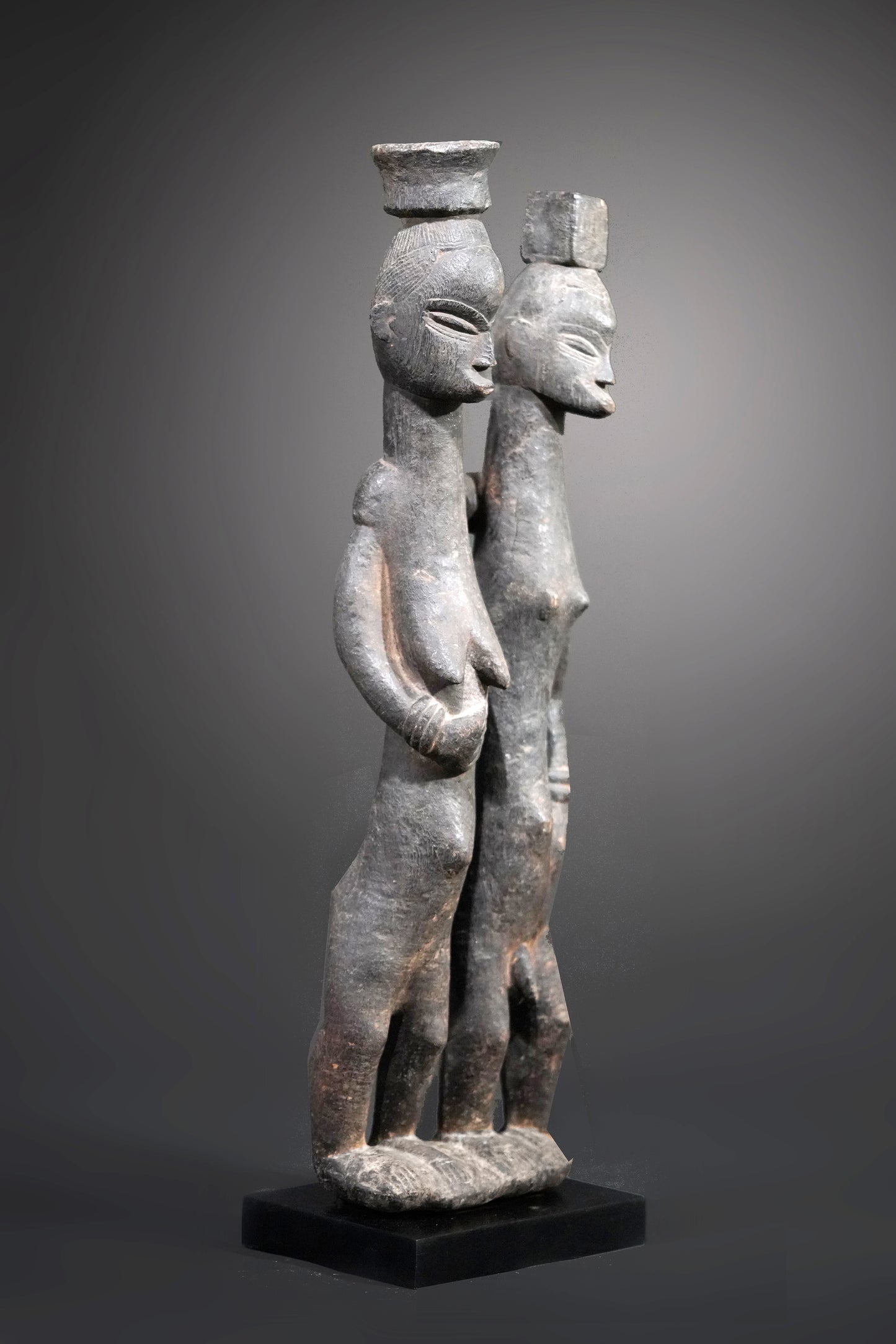 A Guro couple standing on one base