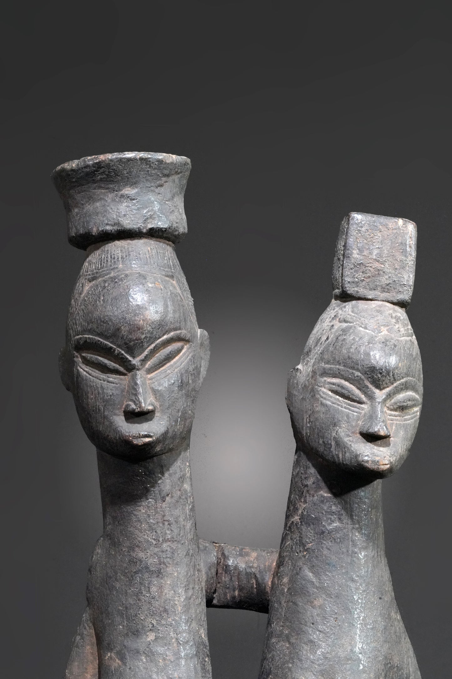 A Guro couple standing on one base
