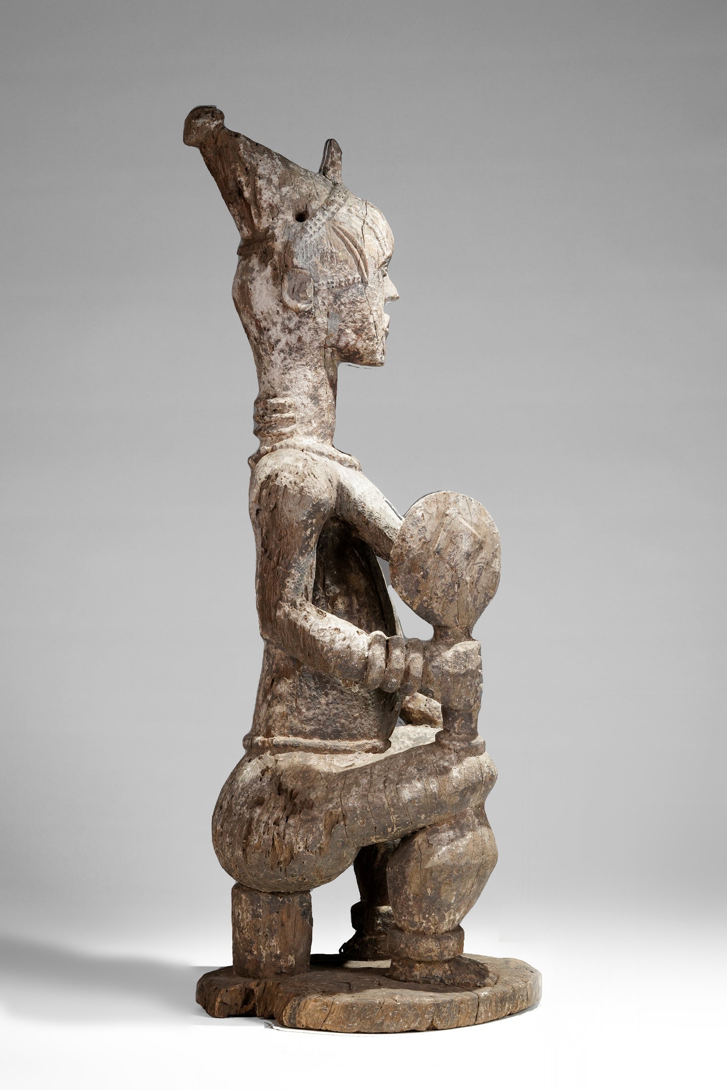 A very expressive female seated Urhobo sculpture