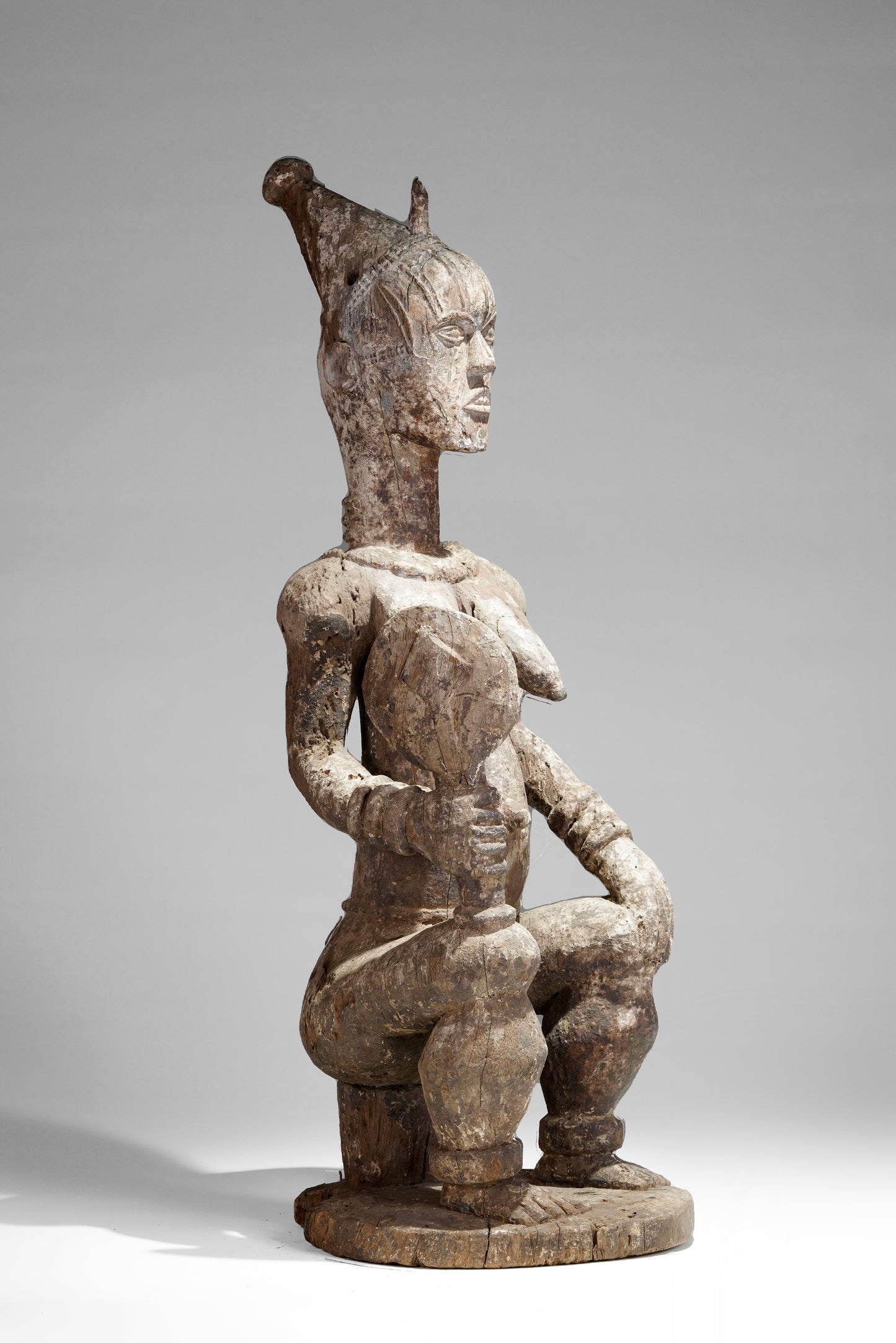 A very expressive female seated Urhobo sculpture