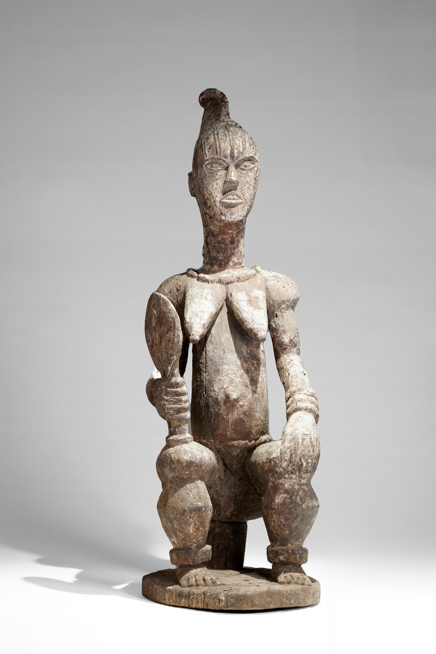 A very expressive female seated Urhobo sculpture