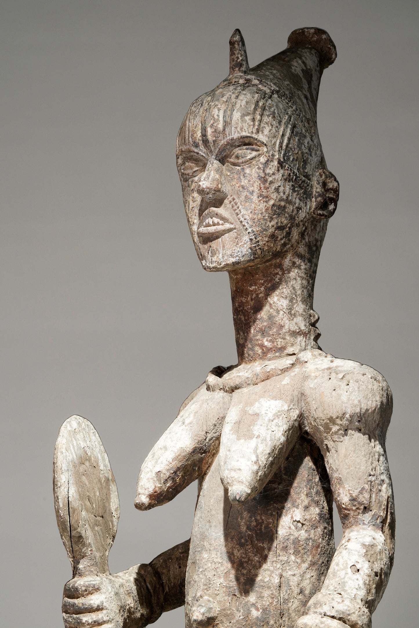 A very expressive female seated Urhobo sculpture