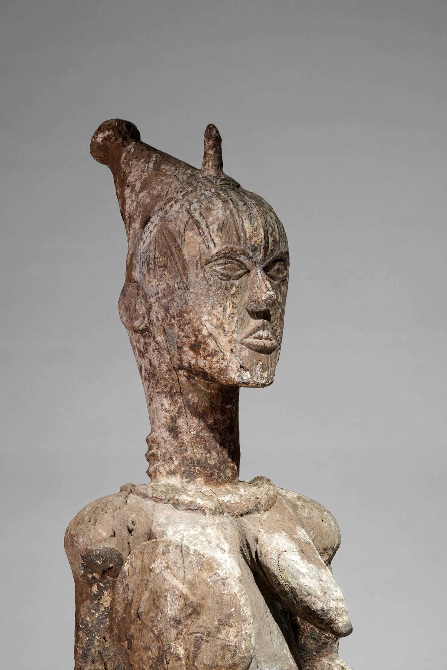 A very expressive female seated Urhobo sculpture
